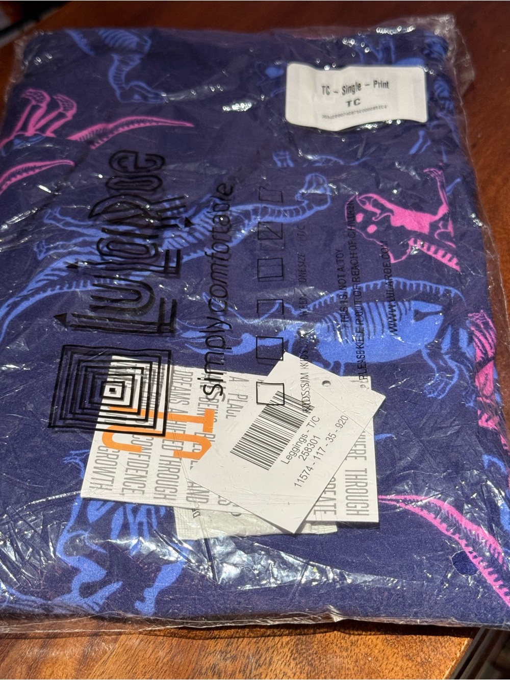LuLaRoe Purple Leggings with Blue and Pink Dino Print